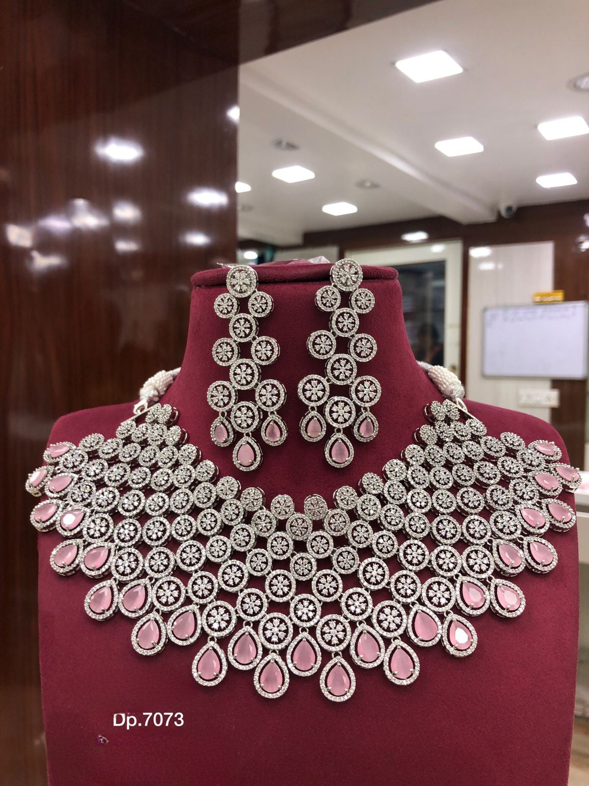 High Quality American diamond Full-bridal Necklace With Earrings available in baby pink on silver polished