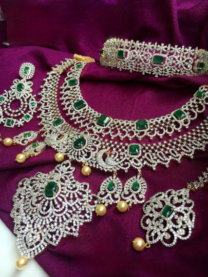 Super grand luxury diamond set , southindain neckband with big earrings , tikka and diamond nath