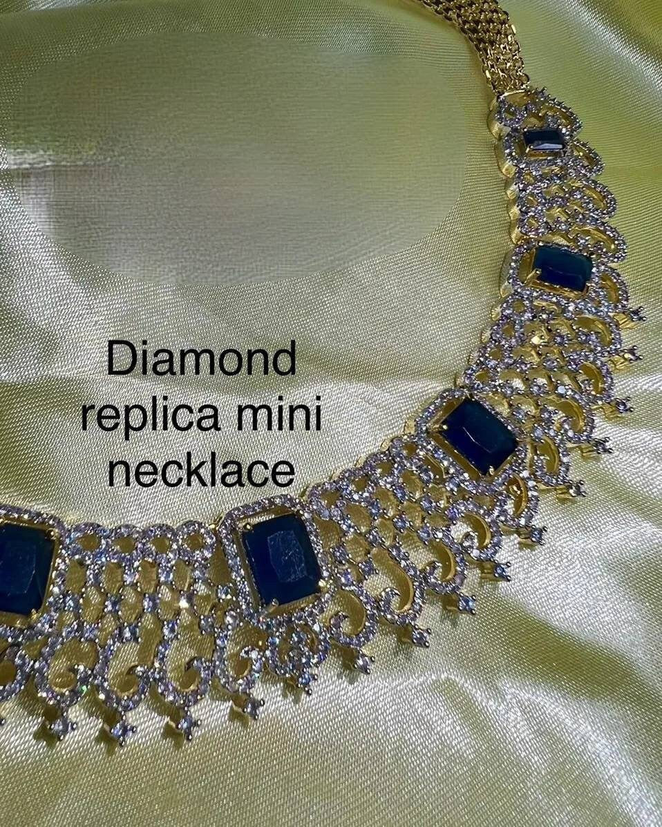 Handcrafted Diamond, Emerald, and Ruby Choker Set with Exquisite Jhumka Earrings