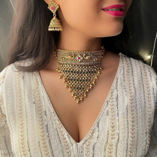 Elegant Golden Brass Kundan Necklace Set with Pearls and Matching Earrings