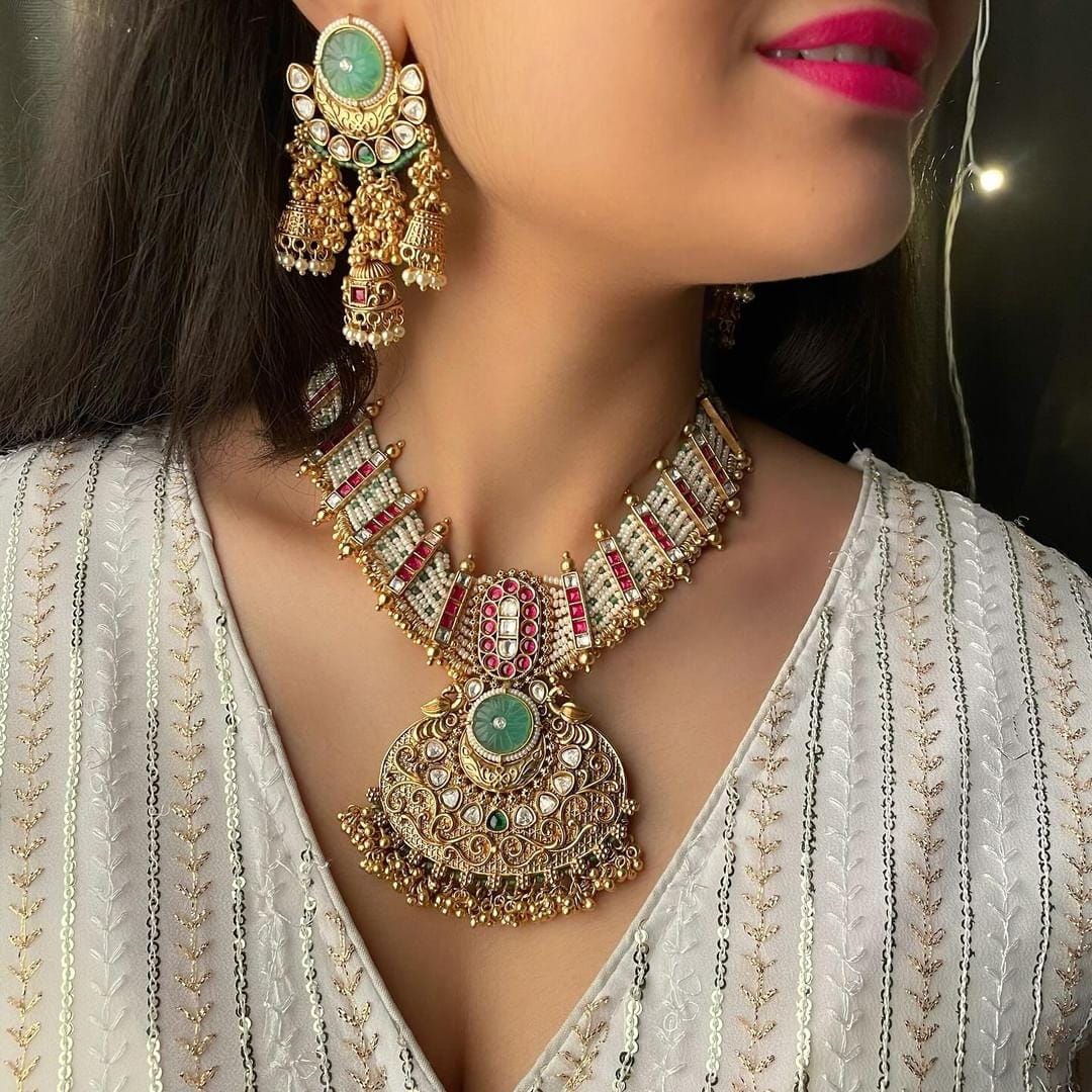 Elegant Golden Brass Kundan Necklace Set with Pearls and Matching Earrings