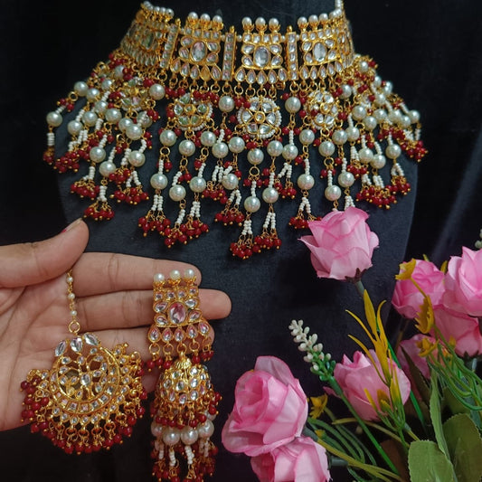 Regal Opulence: Kundan Jewelry Set with Jhumka Earrings and Maangtikka